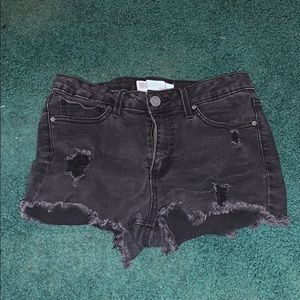 black ripped shorts
